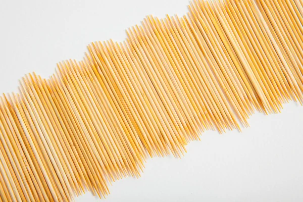 Bunch of toothpicks on white paper background — Stock Photo, Image