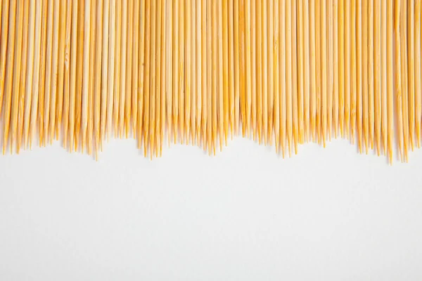 Bunch of toothpicks on white paper background — Stock Photo, Image