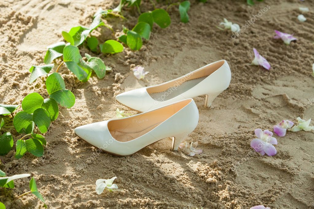 Bridal Shoes On Left Sands In A Beach Wedding Party Stock