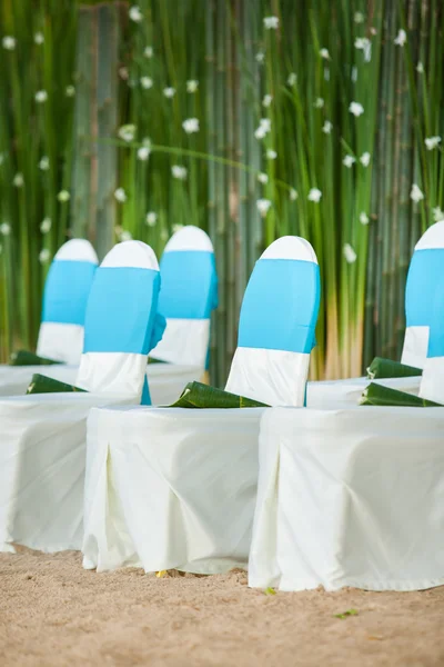 Floral arrangements located on seats at a wedding ceremony — Stock Photo, Image