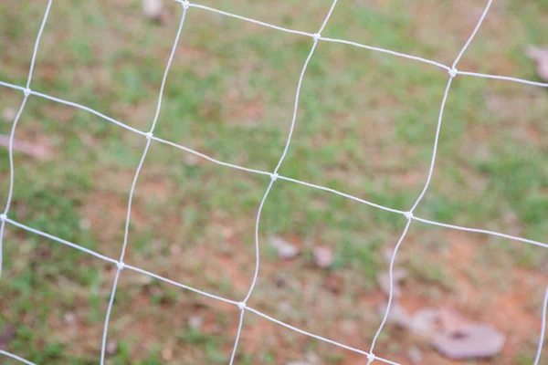 Futebol gol net no fundo desfocado — Fotografia de Stock