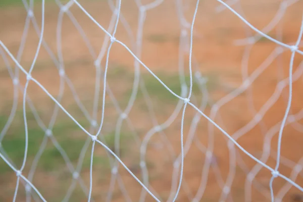 Futebol gol net no fundo desfocado — Fotografia de Stock