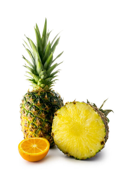 Fresh pineapple and orange isolated on white background