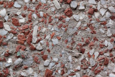 Beton duvar. Kırık tuğladan örülmüş. Arka plan olarak kullanılıyor. Metnin için boşluk kopyala.