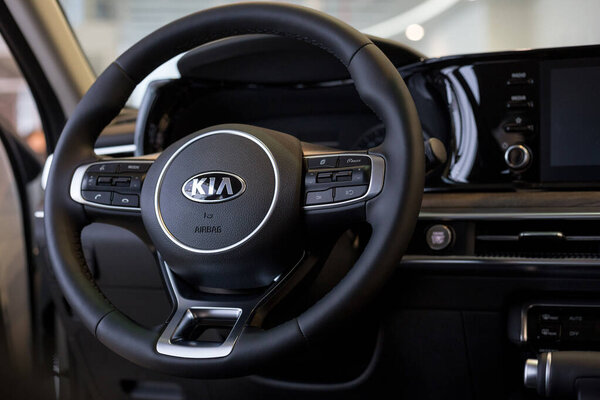 Russia, Izhevsk - December 28, 2020: KIA showroom. Steering wheel and interior of new K5 car business class. Famous world brand.