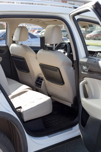 Russia, Izhevsk - September 25, 2020: Skoda showroom. Cream colored leather passenger and driver seats inside Kodiaq car. Back view. — Stock Photo, Image