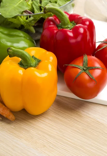 Mix of vegetables on salad on the wood background. — Stock Photo, Image