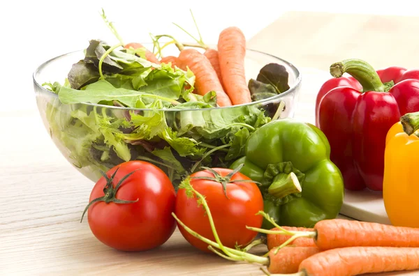 Mix of vegetables on salad on the wood background. — Stock Photo, Image