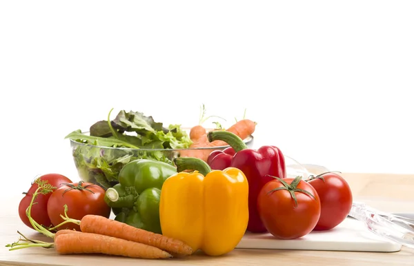 Mix of vegetables on salad on the wood background. — Stock Photo, Image