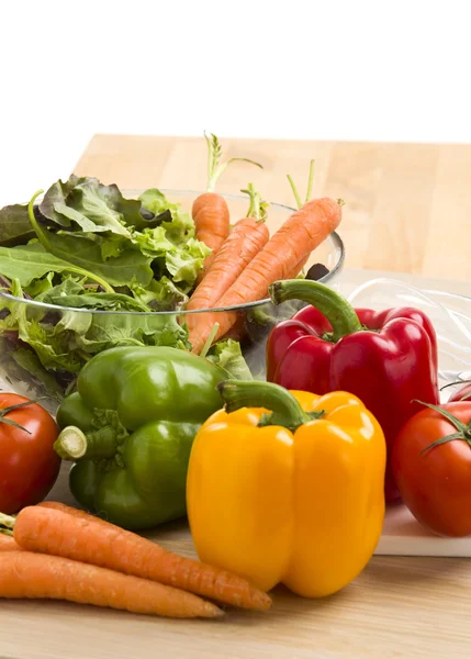 Mix of vegetables on salad on the wood background. — Stock Photo, Image