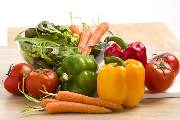 Mix of vegetables on salad on the wood background. — Stock Photo, Image