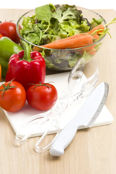 Mix of vegetables on salad on the wood background. — Stock Photo, Image