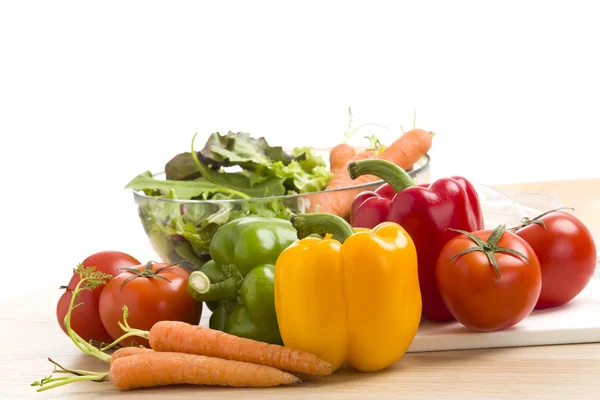 Mix of vegetables on salad on the wood background. Stock Photo