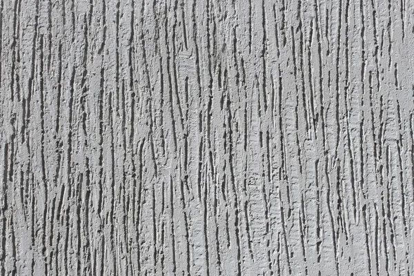 Hobbelig pleister grijs muur — Stockfoto