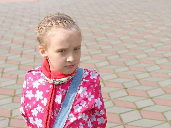 Portrait of small pensive schoolgirl — Stock Photo, Image