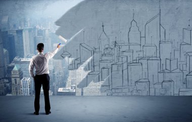 Zarif satıcı şehri duvarda yeniden boyuyor.