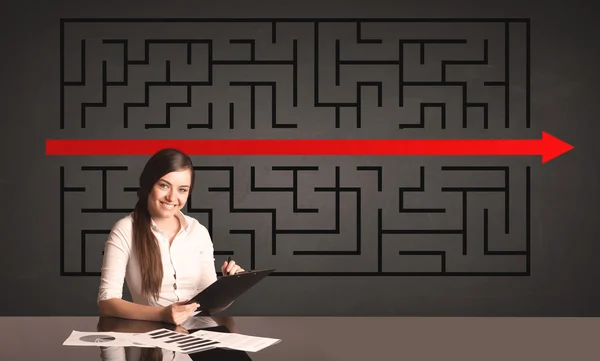 Businesswoman with a solved puzzle in background — Stock Photo, Image