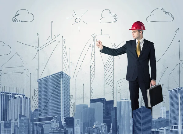 Young worker drawing a city sight — Stock Photo, Image