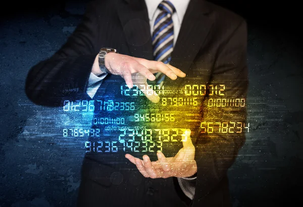 Businessman holding number cloud — Stock Photo, Image