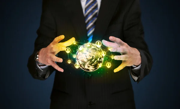 Businessman holding a social media globe — Stock Photo, Image