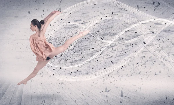 Bailarina de ballet de rendimiento saltando con partículas de explosión de energía —  Fotos de Stock