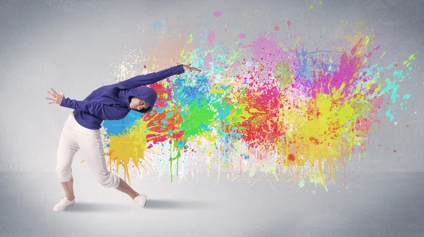 Young colorful street dancer with paint splash — Stock Photo, Image