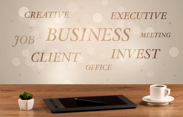 Business office desk with writing on wall — Stock Photo, Image