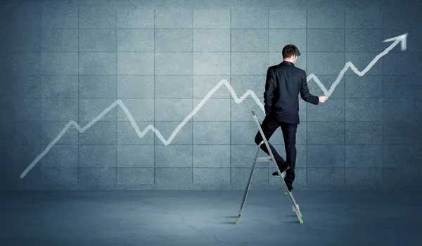 Man drawing line from ladder — Stock Photo, Image