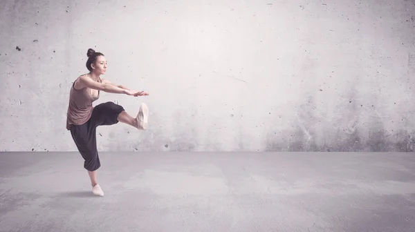 Pretty urban dancer with empty background