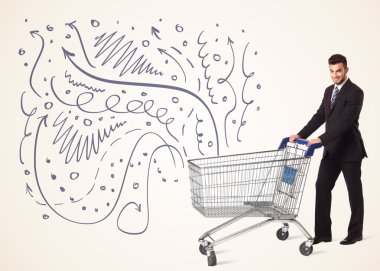 Alışveriş arabalı bir iş adamı.