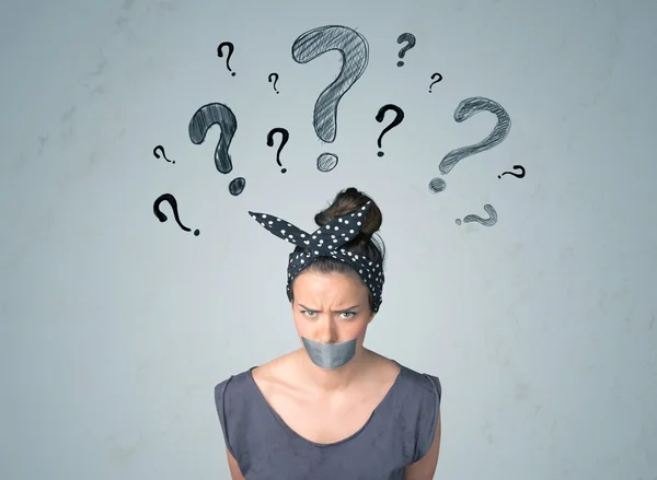 Young woman with glued mouth and question mark symbols — Stock Photo, Image