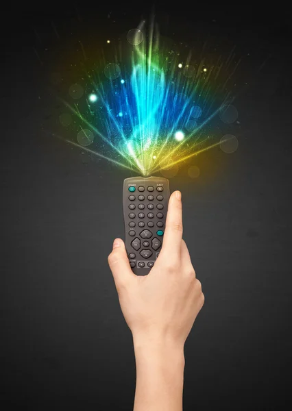 Hand with remote control and explosive signal — Stock Photo, Image