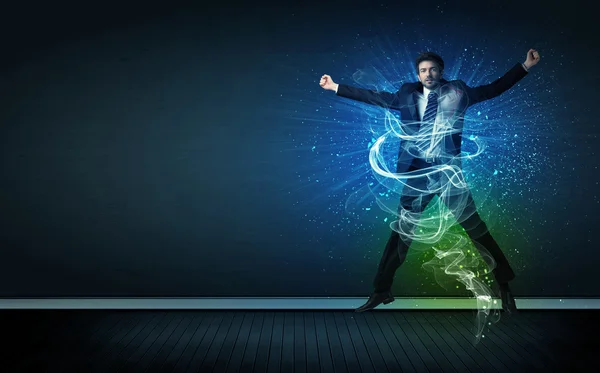 Talentoso hombre de negocios alegre saltando con líneas de energía brillantes — Foto de Stock