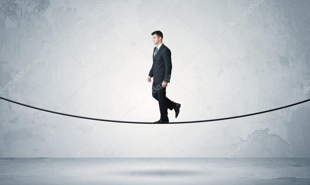 Sales guy balancing on tight rope