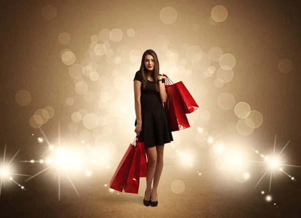 Shopping lady con borse in luci brillanti — Foto Stock