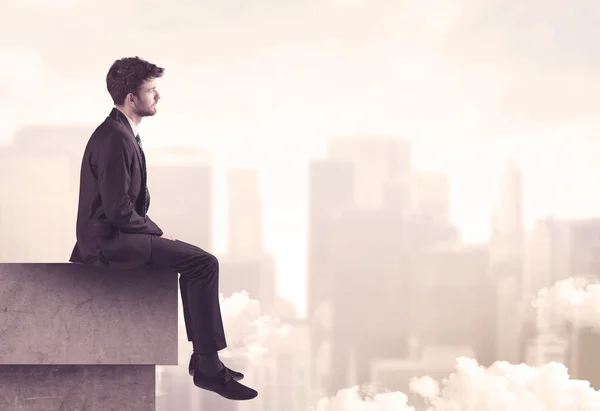 Peaceful sales guy sitting on roof top — Stock Photo, Image