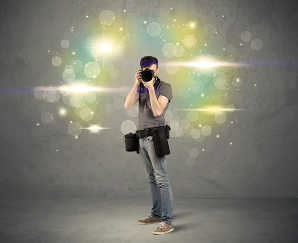 Photographer with flashing lights — Stock Photo, Image