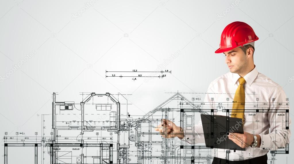 An young architect drawing a house plan