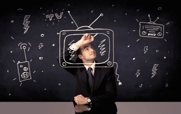 Happy businessman drawing tv and radio — Stock Photo, Image