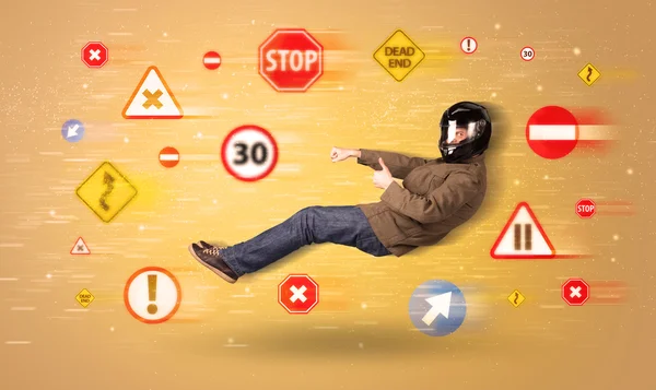 Young driver with road signs around him — Stock Photo, Image