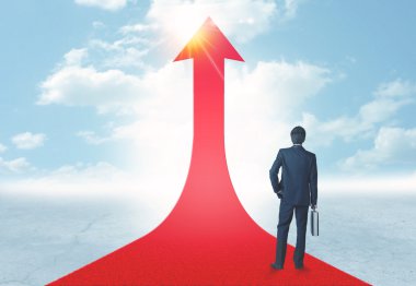 üzerinde kırmızı bir ok ayakta işadamı