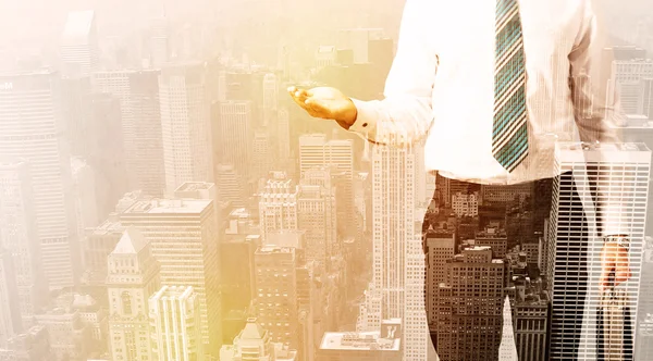 Business man looking at overlay city background — Stock Photo, Image