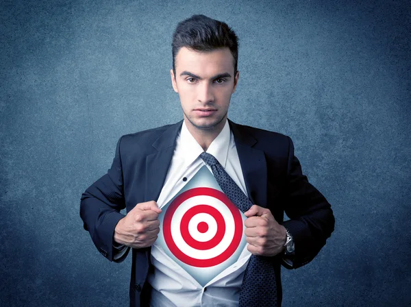 Businessman tearing shirt with target sign on his chest — Stock Photo, Image