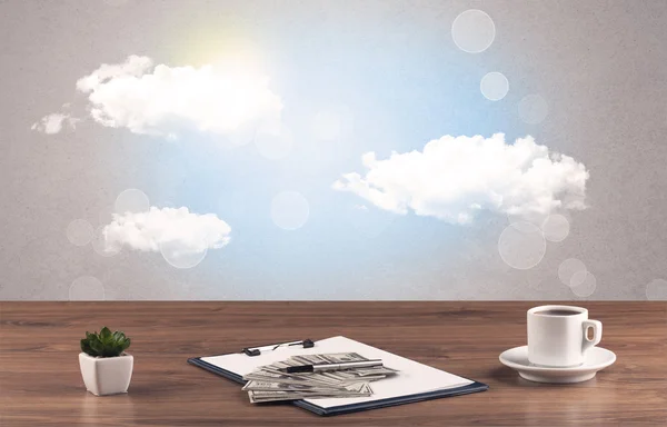 Bright sky with clouds and office desk — Stock Photo, Image