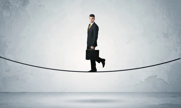 Sales guy balancing on tight rope — Stock Photo, Image