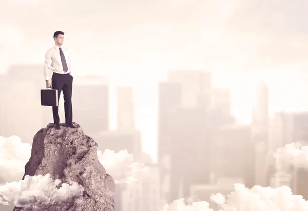 Confident businessman on dangerous cliff — Stock Photo, Image