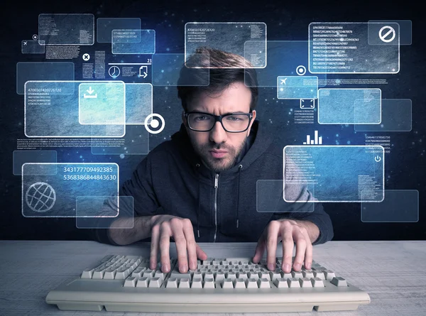 Nerd with glasses hacking websites — Stock Photo, Image