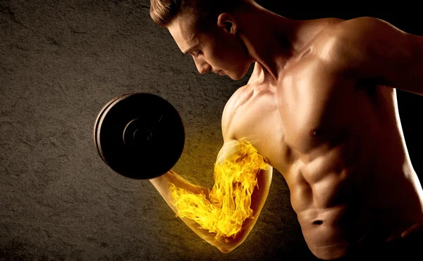 Muscular bodybuilder lifting weight with flaming biceps concept — Stock Photo, Image