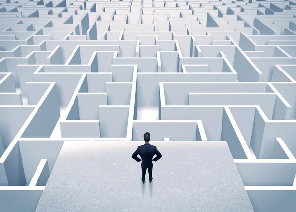 Businessman staring at infinite maze — Stock Photo, Image