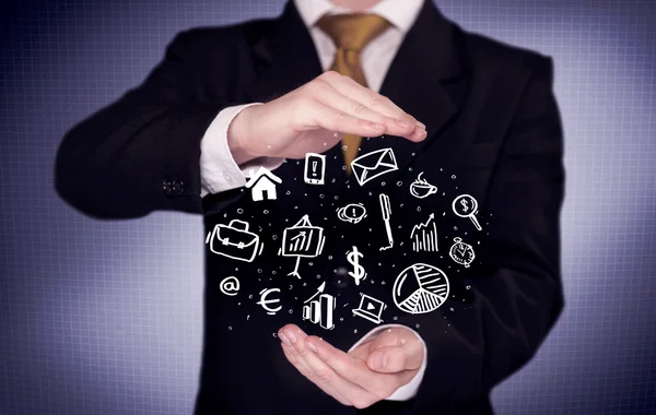 Office worker with drawn icons in the palm — Stock Photo, Image
